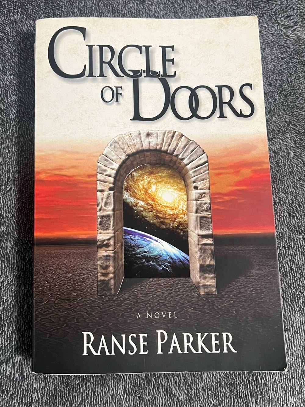 Circle of Doors by Ranse Parker - Book with Sunset Cover
